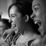 laughing crowd at date night event